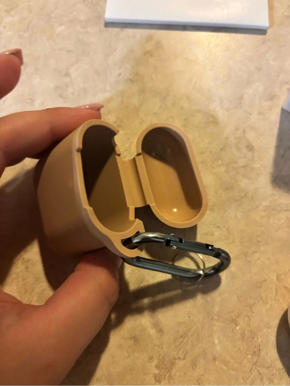 Apple AirPods Pro with White Earbuds and Tan Silicone Case